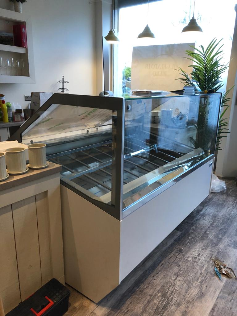 Delvado engineer servicing a commercial ice cream display unit